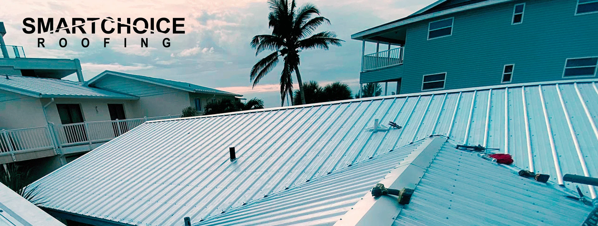 Metal roofs with palm tree and logo.